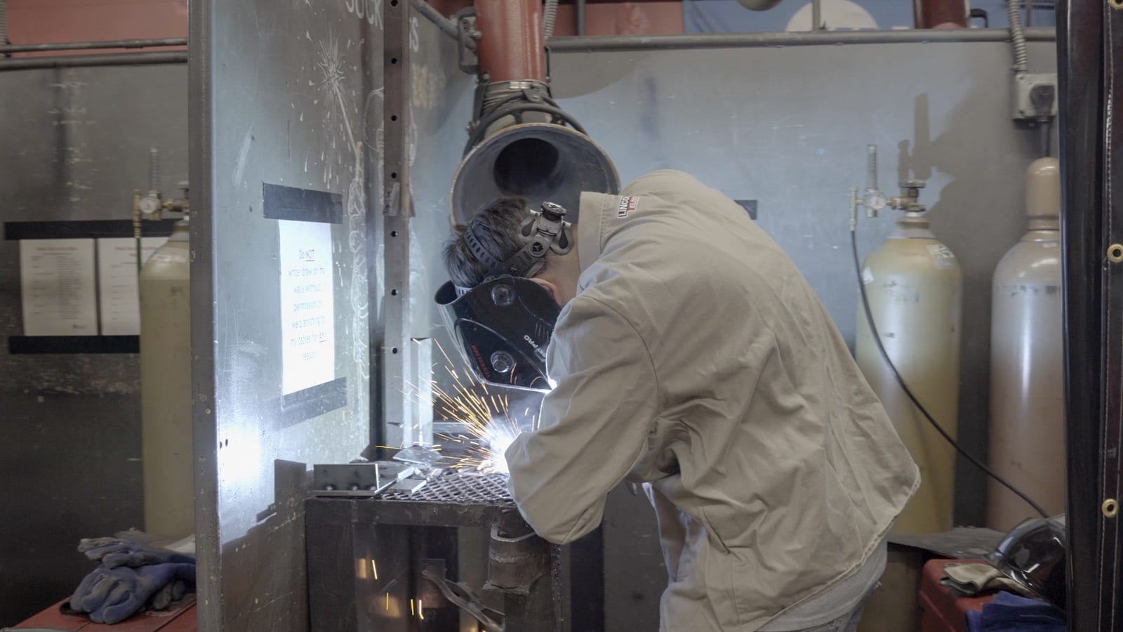 Student practicing MIG welding